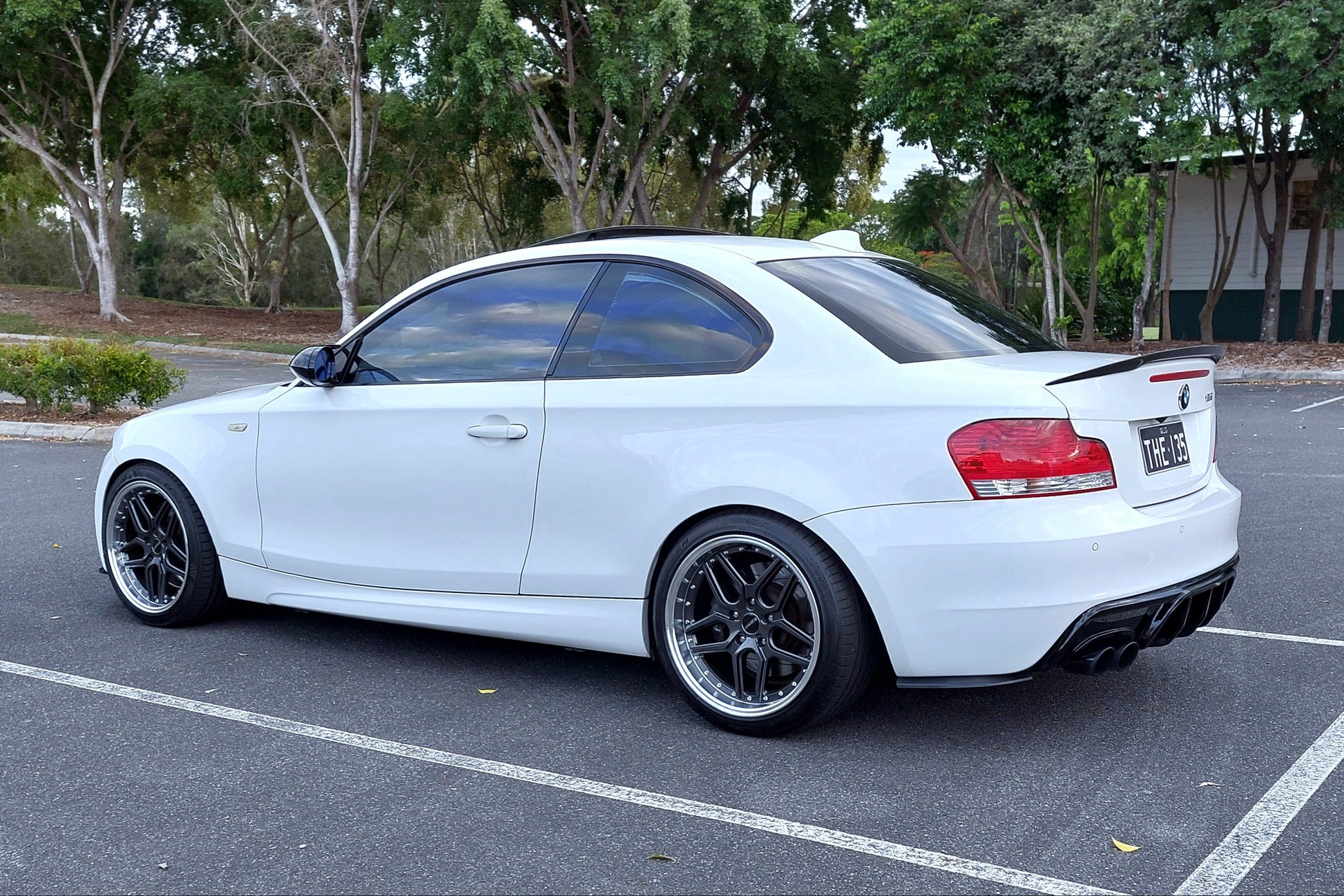 White BMW car parked in a parking lot wit D-Speed DSpeed DS-09 DS09 wheels 18inch 8.5 9.5 5x120