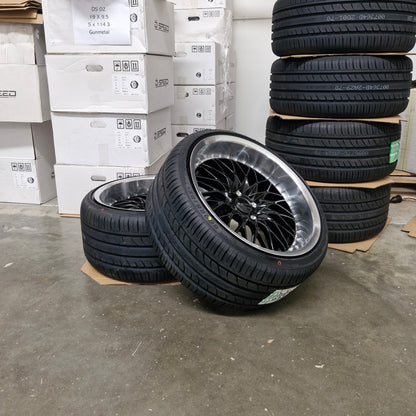 Tires stacked on top of boxes in a warehouse setting
