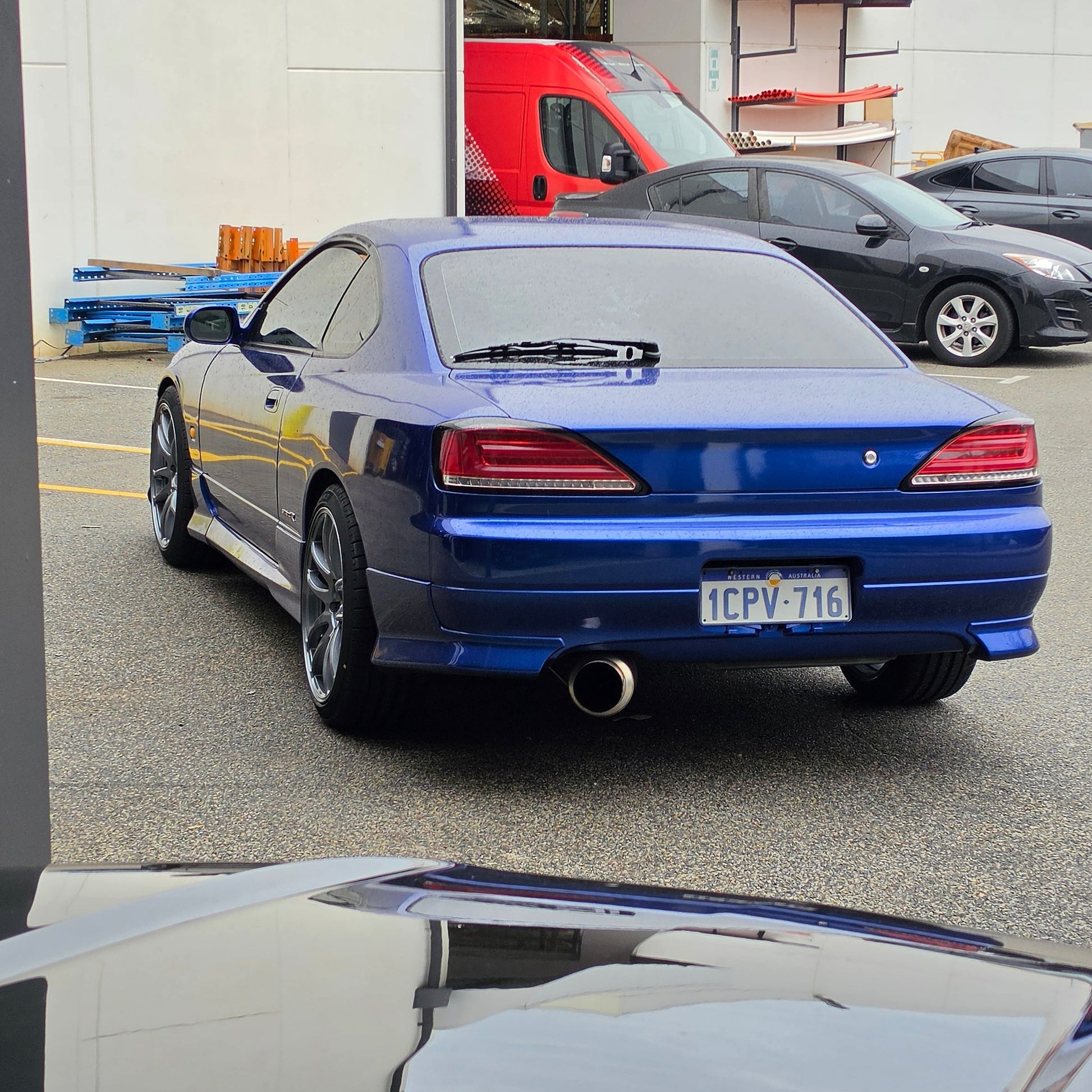 A blue Nissan 200sx s15 s13 s14 sports car parked on an asphalt DSpeed performance wheels D-Speed ds02 ds-02 wheels 18x8.5 +25 5x114.3 Gunmetal rims tyres wheel and tyre package