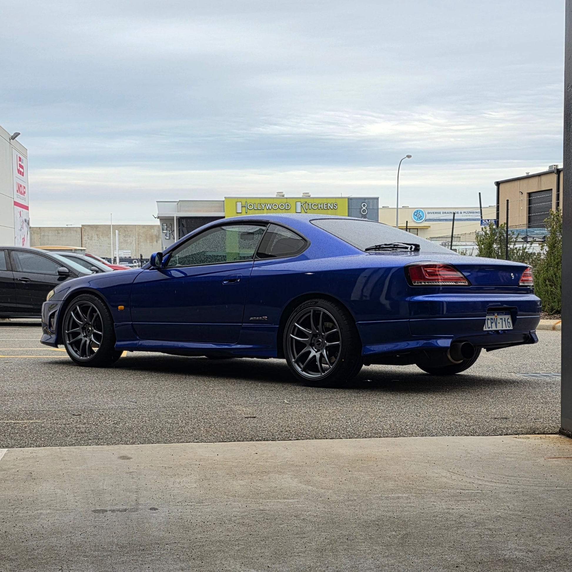 A blue Nissan 200sx s15 s13 s14 sports car parked on an asphalt DSpeed performance wheels D-Speed ds02 ds-02 wheels 18x8.5 +25 5x114.3 Gunmetal rims tyres wheel and tyre package