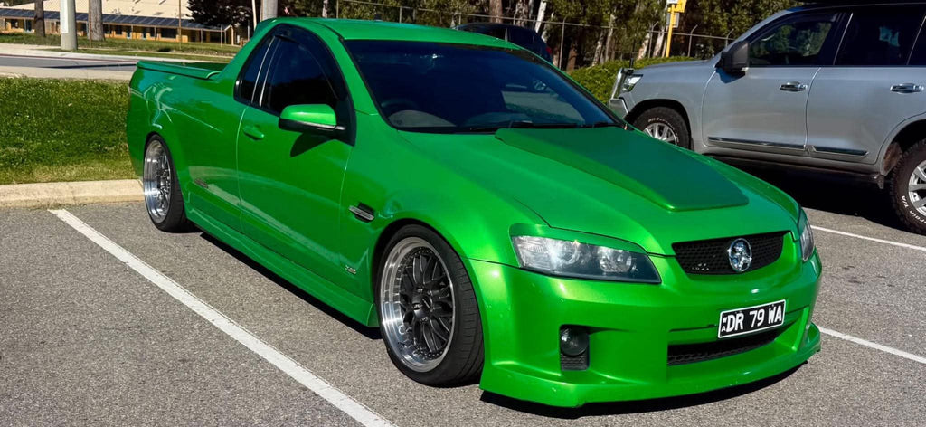 A bright green modified Holden Commodore Super LS pickup truck parked on a grassy lawn outdoors. dspeed ds06 D-speed DS-06 19inch 19x8.5 19x9.5 dish dished wheels rims tyres