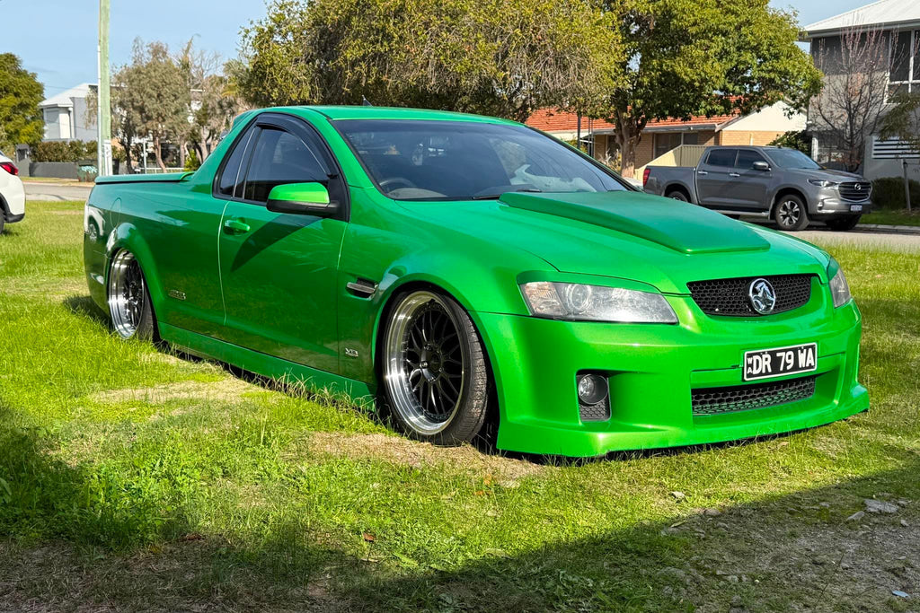 A bright green modified Holden Commodore Super LS pickup truck parked on a grassy lawn outdoors. dspeed ds06 D-speed DS-06 19inch 19x8.5 19x9.5 dish dished wheels rims tyres