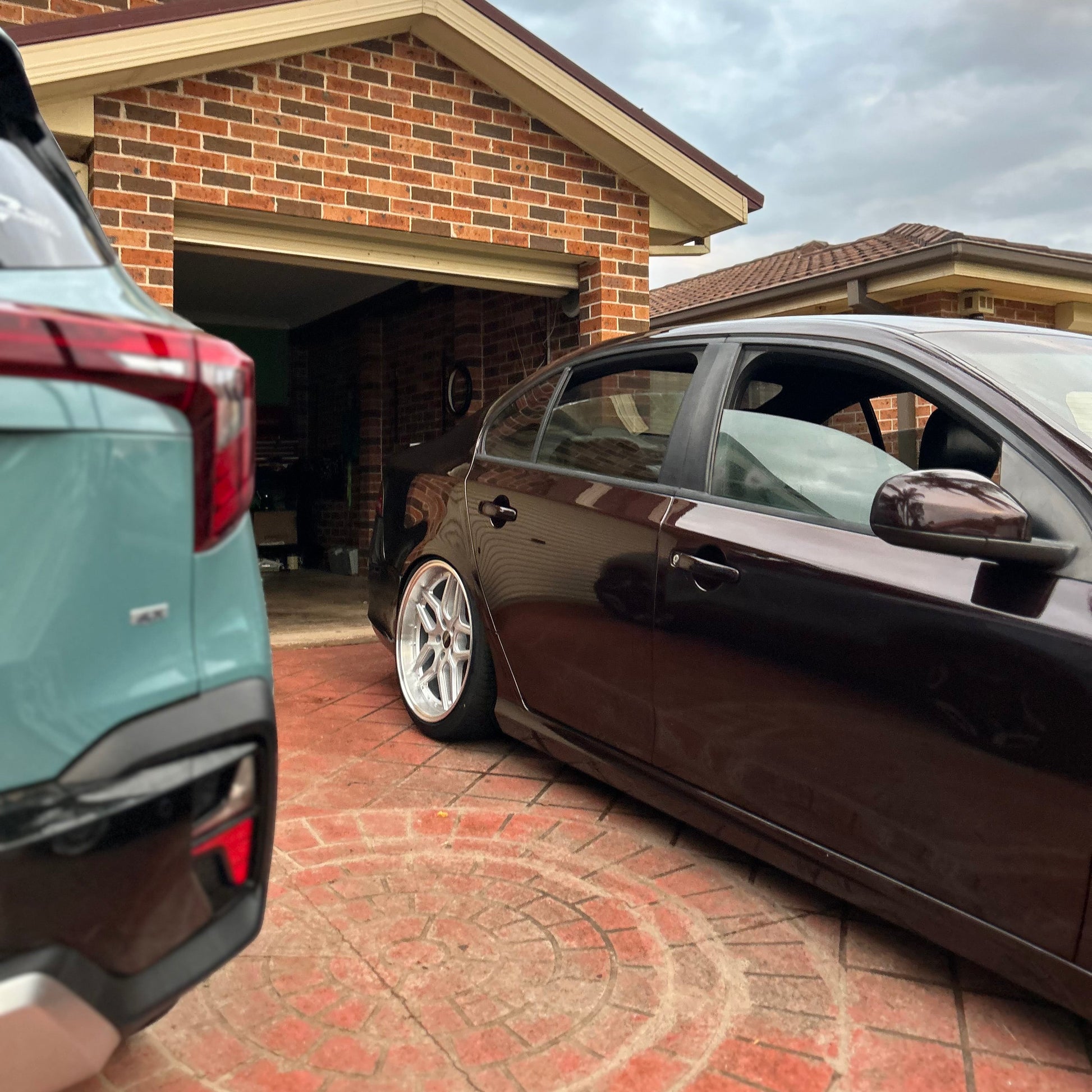 Black sedan car parked on a driveway with houses and palm trees in the background D-Speed DS-09 dspeed ds09 19inch wheels 19x9.5 silver dish alloy wheels