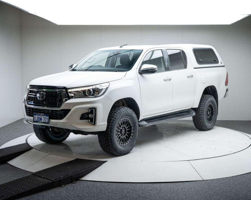 A white Toyota Hilux double cab pickup truck with a black grille, Satin black DSpeed D-Speed mh-2 mh2 wheels with roadcruza offroad all terrain tyres 275/70R17 4x4 rims wheels alloys off road