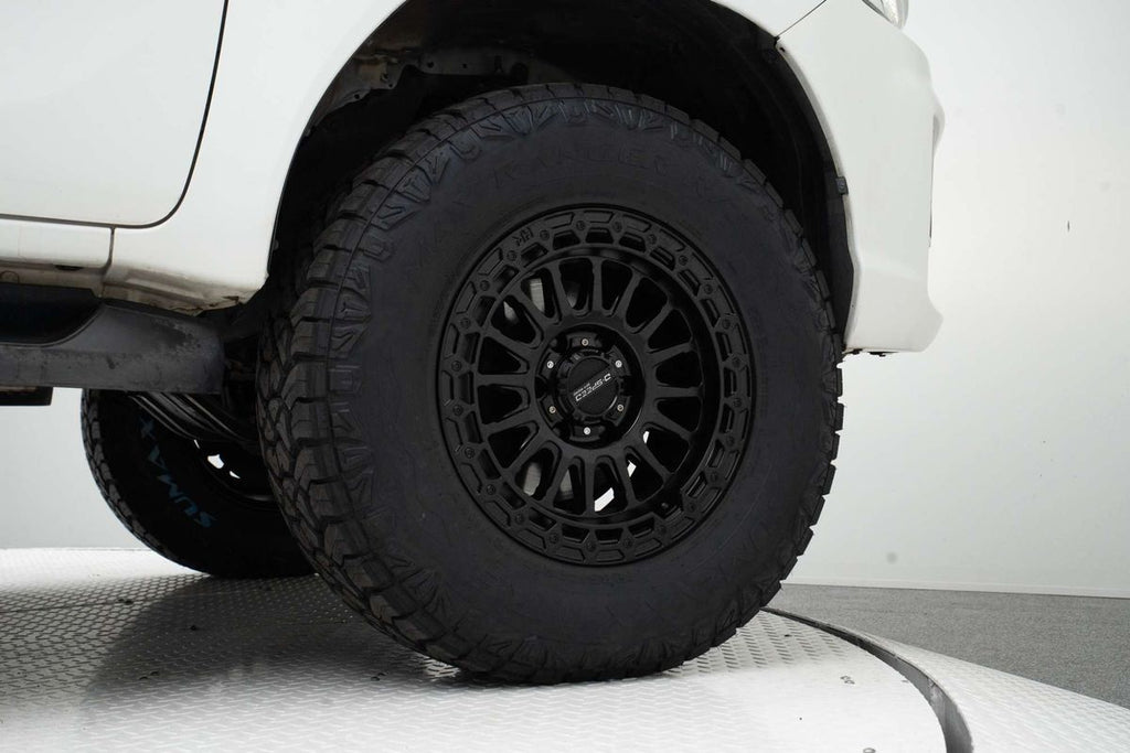 A white Toyota Hilux double cab pickup truck with a black grille, Satin black DSpeed D-Speed mh-2 mh2 wheels with roadcruza offroad all terrain tyres 275/70R17 4x4 rims wheels alloys off road