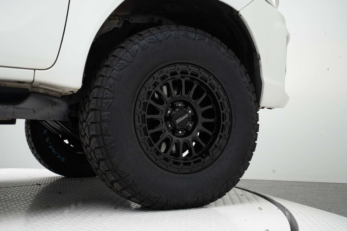A white Toyota Hilux double cab pickup truck with a black grille, Satin black DSpeed D-Speed mh-2 mh2 wheels with roadcruza offroad all terrain tyres 275/70R17 4x4 rims wheels alloys off road