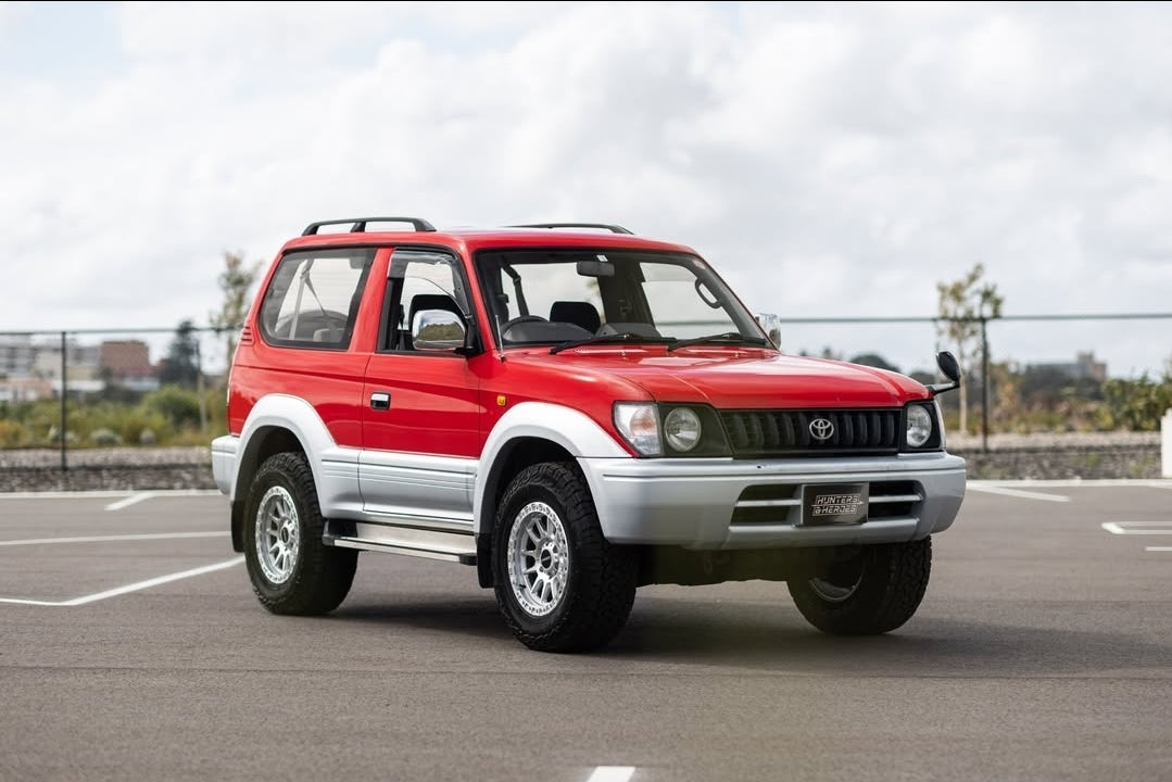 Red and silver SUV on a road with a cloudy sky dspeed xt-1 xt1 4x4 wheels