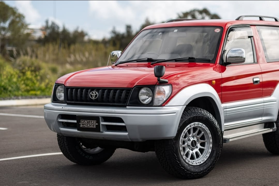 Red and silver SUV on a road with a cloudy sky dspeed xt-1 xt1 4x4 wheels