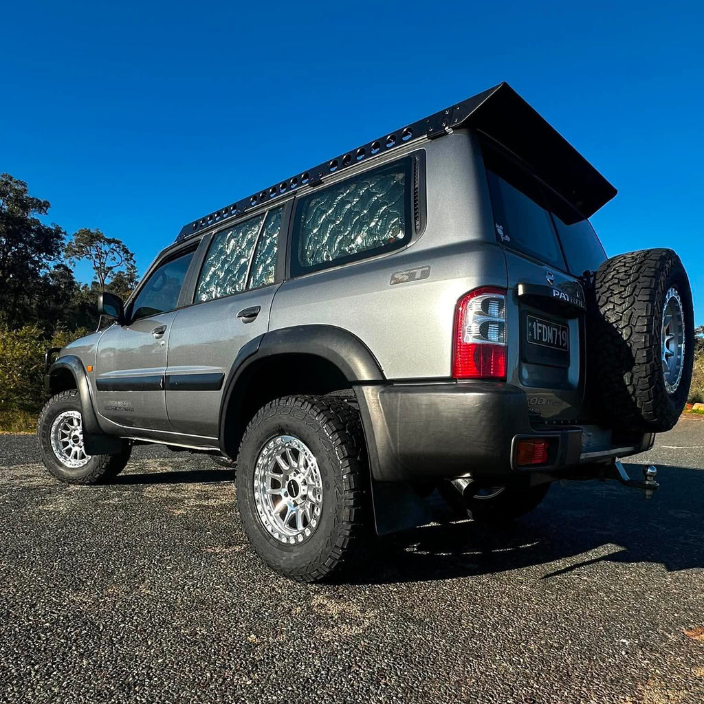 A silver lifted Nissan Patrol GU SUV with dspeed offroad off road t1 xt-1 wheels rims AT all terrain tyres 285/70R17 33inch 17x9 0 offset wheels